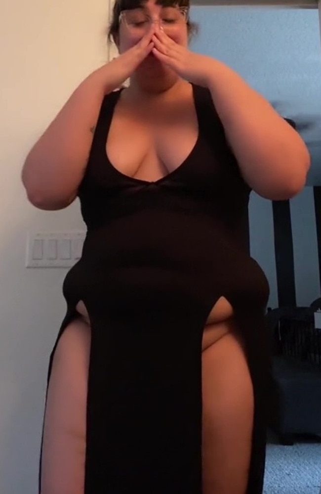 This woman couldn’t stop laughing after splashing out on a dress on Amazon, only to find it flashed a lot of flesh. Picture: TikTok/girlfriendxoxoxo