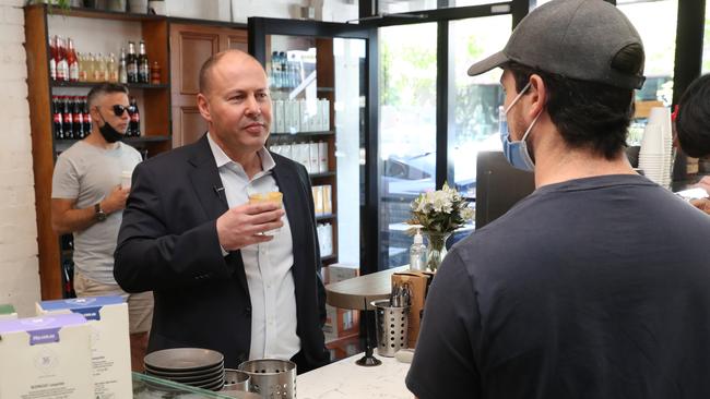 The Treasurer talks to a cafe owner in the Melbourne suburb of Hawthorn last week. Picture: NCA NewsWire/David Crosling