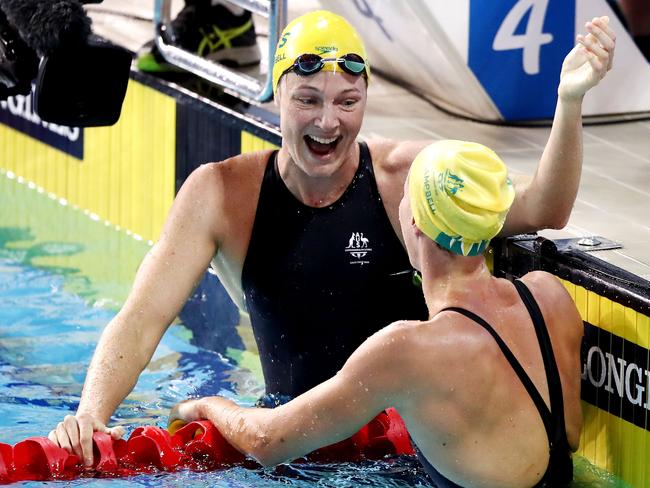 Cate and Bronte Campbell embrace following the women's 100m freestyle final. Picture: Hannah Peters/Getty Images