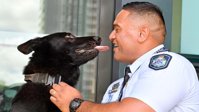 Senior Constable Joe Alofipo was reunited with his best mate Bravo after a stranger dropped the police dog to a local police station on Sunday. Picture: John Gass.