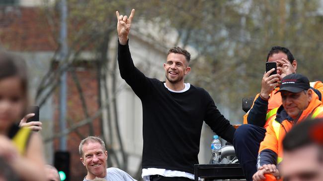 Brett Deledio climbed onto a truck in the crowd cheering on his teammates at the Grand Final Parade: Phil Hillyard