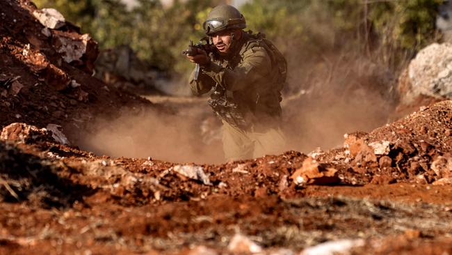 An Israeli army soldier advances during a drill at a position in the upper Galilee region of northern Israel. Picture: AFP