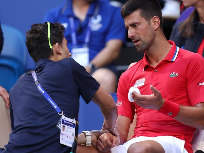 PERTH, AUSTRALIA – JANUARY 03: Novak Djokovic of Team Serbia receives treatment to his right arm during his singles match against Alex de Minaur of Team Australia during day six of the 2024 United Cup at RAC Arena on January 03, 2024 in Perth, Australia. (Photo by Paul Kane/Getty Images)