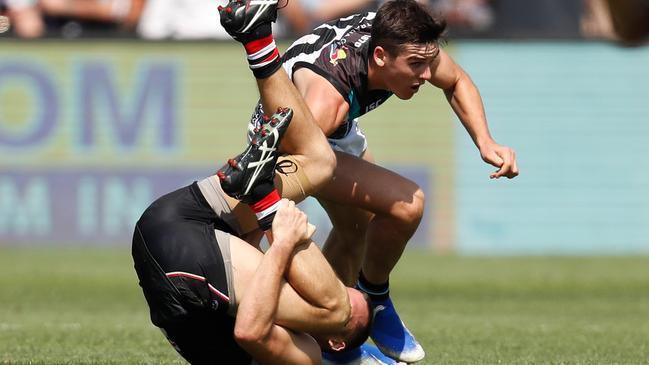 Connor Rozee runs down Jarryn Geary on Sunday. Picture: Michael Willson/AFL Photos