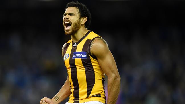 Cyril Rioli of the Hawthorn Hawks yells as he scores a goal to fight back in the second quarter during the North Melbourne Kangaroos and Hawthorn Hawks round 13 match at Etihad Stadium in Melbourne, Friday, June 17, 2016. (AAP Image/Tracey Nearmy) NO ARCHIVING, EDITORIAL USE ONLY