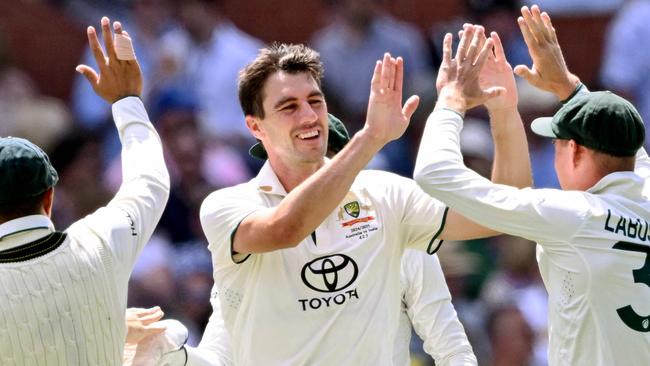 Australia's Pat Cummins celebrates taking a wicket on the third day of the second cricket Test match between Australia and India at the Adelaide Oval in Adelaide on December 8, 2024. (Photo by William WEST / AFP) / -- IMAGE RESTRICTED TO EDITORIAL USE - STRICTLY NO COMMERCIAL USE --