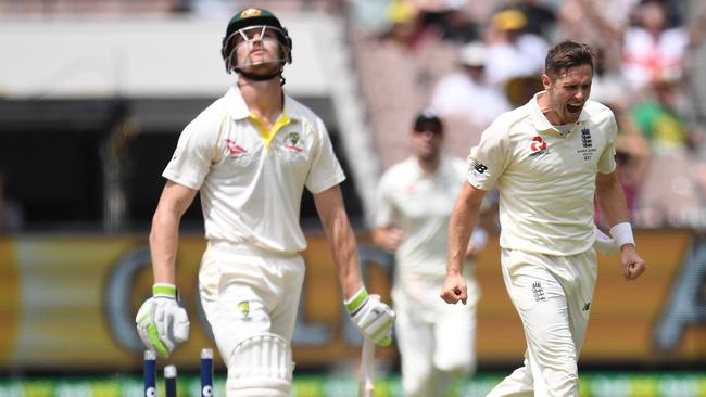 Cameron Bancroft (L) reacts after being bowled by Chris Woakes.