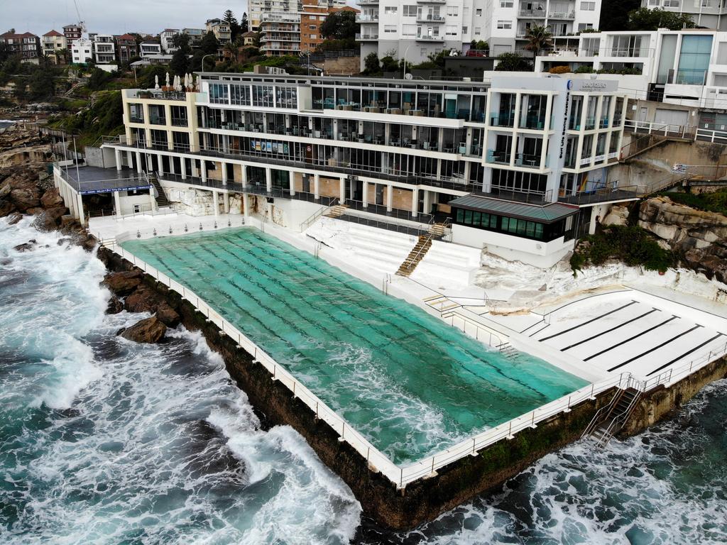 The effect of coronavirus takes affect on various places around Sydney with crowds being told not to congregate in public places. A deserted Bondi Icebergs after being forced to close down. Picture: Toby Zerna