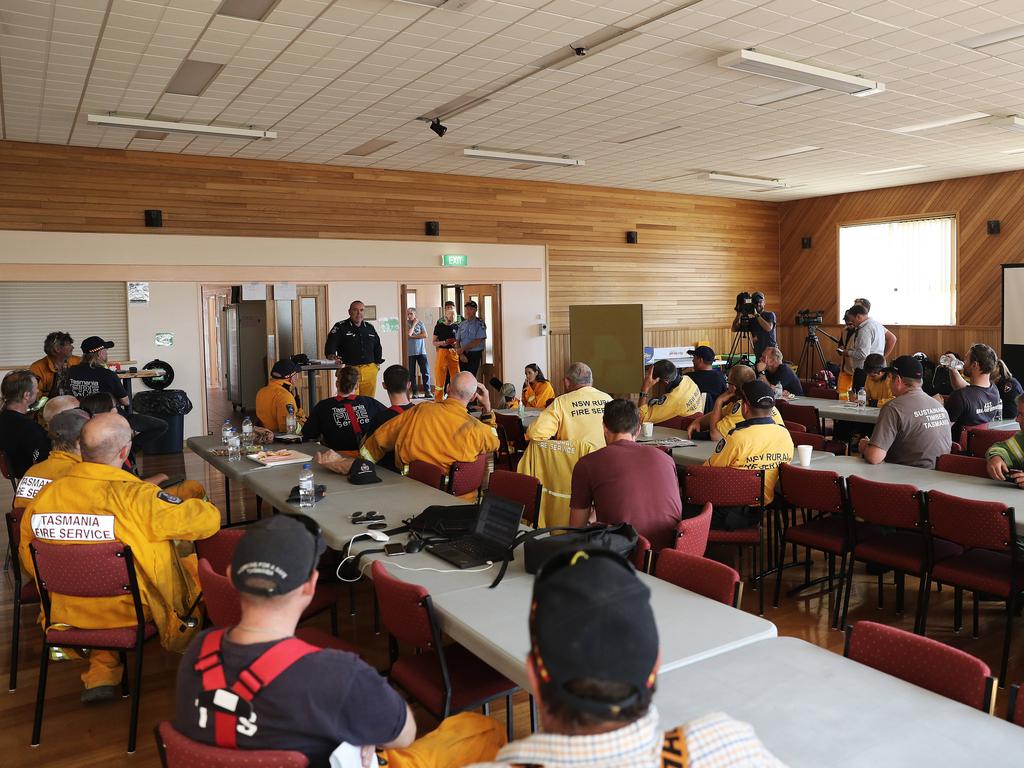 North Regional Chief Officer Jeff Harper (right) giving an update on the fires surrounding Miena as advice level advances to Emergency Warnings. Picture: LUKE BOWDEN