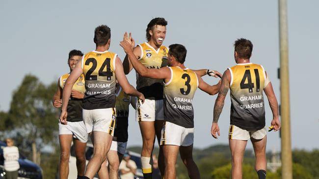 MPNFL football: Frankston Bombers v Frankston YCW. YCW players celebrate the goal of Zachary Barrett. Picture: Valeriu Campan