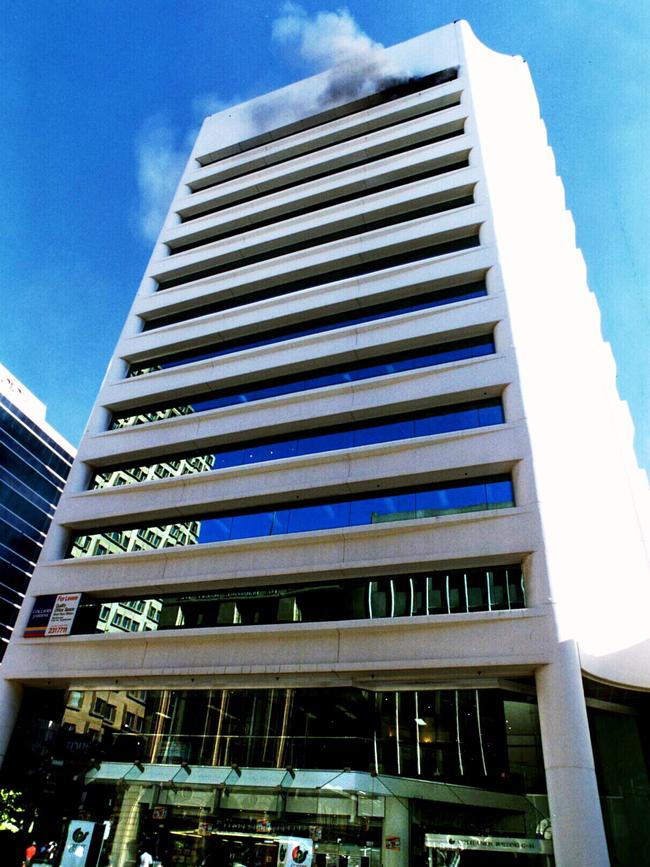 Smoke billows from 12th floor of National Crime Authority building in Adelaide after the bombing. Picture: Chris Mangan