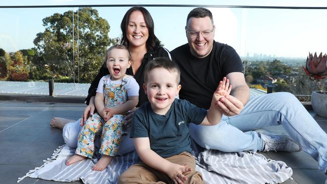 Kathy and Glenn Stalley at home in Sydney with Eve and George, who has the rare disease Duchenne Muscular Dystrophy. Picture: John Feder