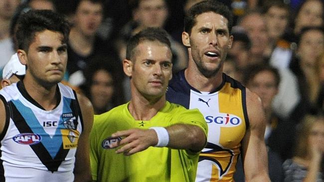 Darren Glass argues with the umpire after his hit on Power young gun Chad Wingard. Picture: Justin Benson-Cooper