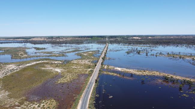 Floodwaters rise on either side of Bookpurnong Road, looking towards Loxton. Picture: Matty Schiller