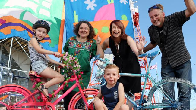 Siblings Charlotte, 5, and Lockie, 4, from North Haven are looking forward to the Tour Down Under in Port Adelaide along with Sarah-Jane Cook from Roustabout Art, Sue Finch from Michonne Wine Bar and Tom James From Mixed Creative. Picture: AAP/Emma Brasier