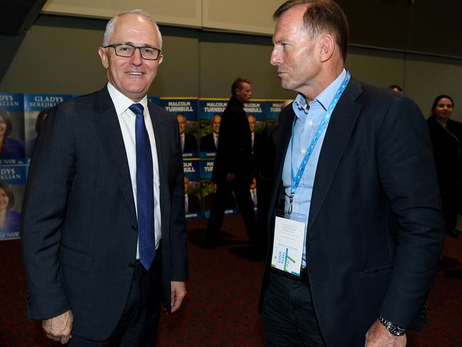 Prime Minister Malcolm Turnbull and former prime minister Tony Abbott speak during the NSW Liberal convention, at Rosehill Racecourse. Picture: Dan Himbrechts.