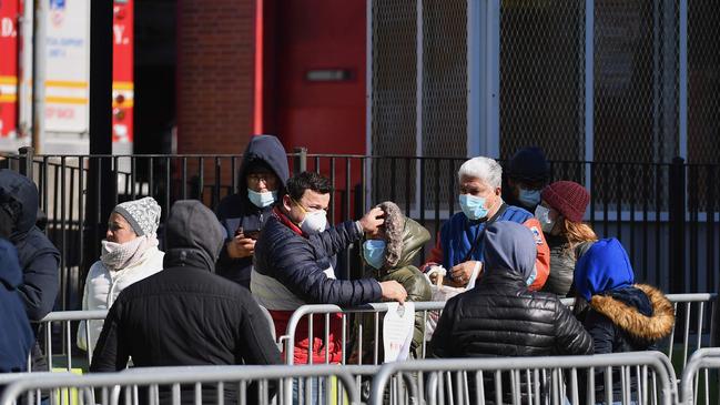 People stand in line to get tested at Elmhurst Hospital Center in Queens, New York. Picture: AFP