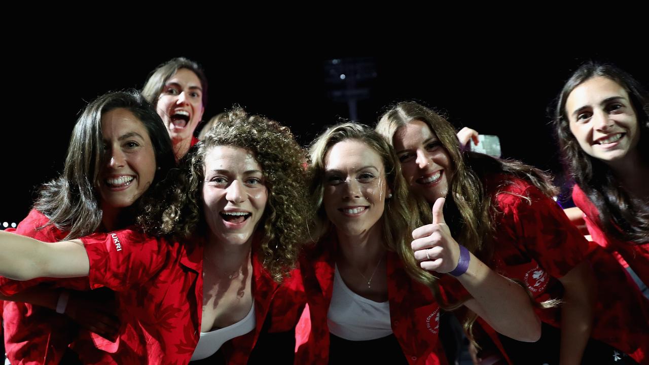 Canada’s team give a thumbs up to the camera.