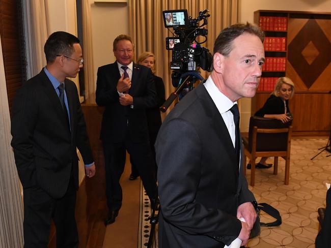 Health minister Greg Hunt (right) departs a press conference at the Commonwealth Parliamentary Offices in Melbourne, April 29. Andrew Forrest (centre) had controversially invited Chinse diplomat Long Zhou to the briefing. Picture: AAP Image/James Ross