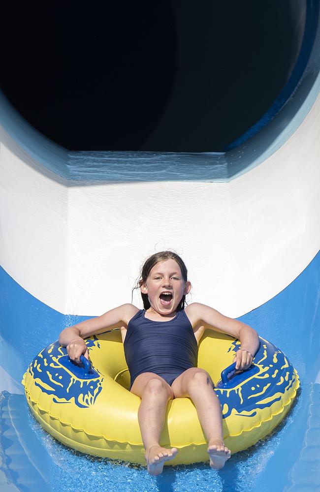 Kids, including Indigo, have a ball on the water slides at the Oak Park Sports and Aquatic Centre but it hits parents’ hip pockets to go there. Picture: Ellen Smith