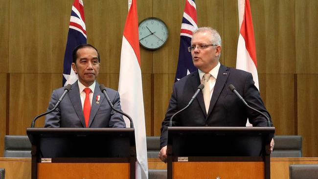 Indonesia's President Joko Widodo, left, and Prime Minister Scott Morrison, right, give a joint statement at Parliament House in Canberra. Picture: AFP