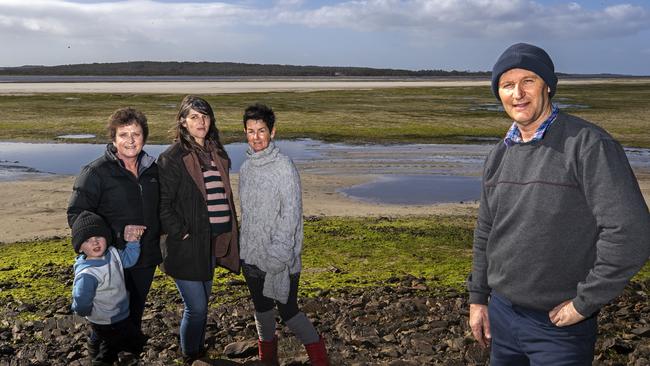 (L-R) Montague residents and members of the Circular Head Coastal Awareness Network (L-R) Hunter Anderson 2, Kim Anderson, Rebecca Tyers, Colleen Murfitt and Bevan Anderson at the proposed site of the bridge/ causeway for the Robbins Island wind farm development at Montague. PICTURE CHRIS KIDD