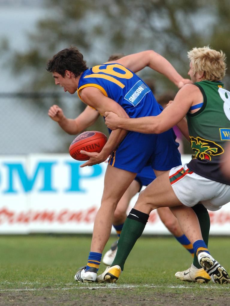 Scott Pendlebury being tackled while playing for Williamstown vs. Tasmania in 2006.