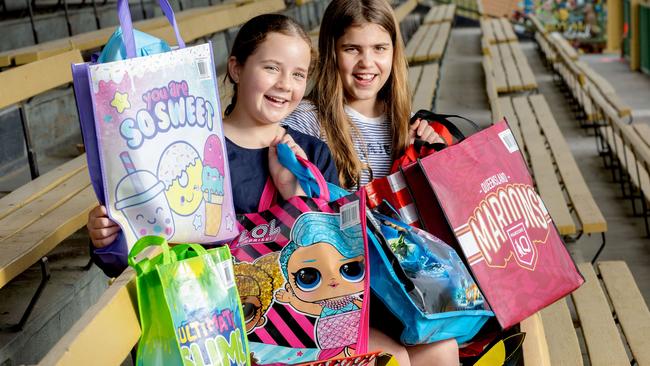 11-year-olds Annabelle Cotter and Eve Roberts at RNA Showgrounds with EKKA showbags, Wednesday, July 12, 2023 - Picture: Richard Walker