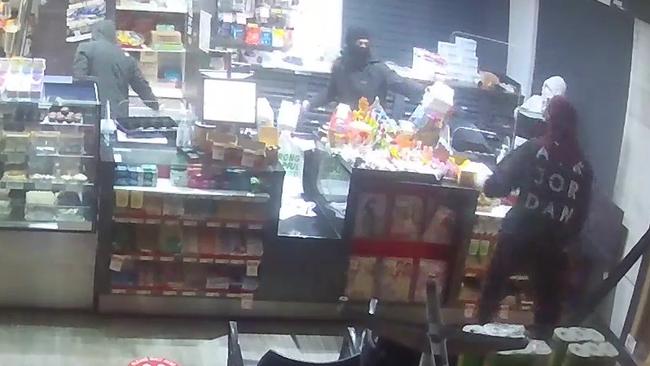 Thieves inside the Spar Express in Oxenford on Thursday morning.