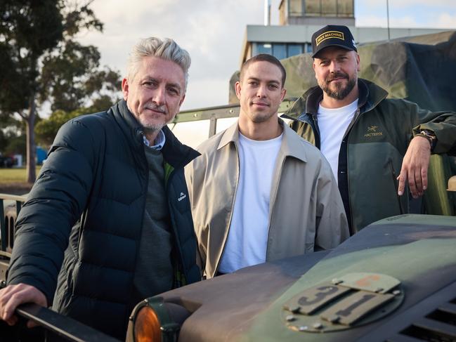 War Machine is a $100m Netflix film shooting at the RAAF base at Laverton.L-R: Producer Greg McLean, actor Blake Richardson and director and co-writer Patrick Hughes on the set of War Machine. Picture credit: Ben King.