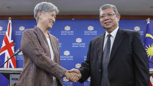 Penny Wong, left, with Malaysian Foreign Minister Saifuddin Abdullah in Putrajaya, Malaysia, on Tuesday. Picture: Joshua Paul