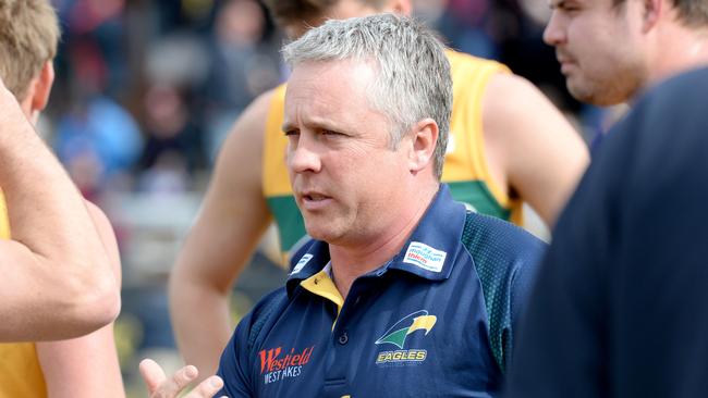 Eagles coach Michael Godden talks to his players. Picture: Greg Higgs