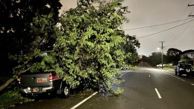 A tree came down on a car in Townsville as Tropical Cyclone Kirrily crossed. Photo: Evan Morgan