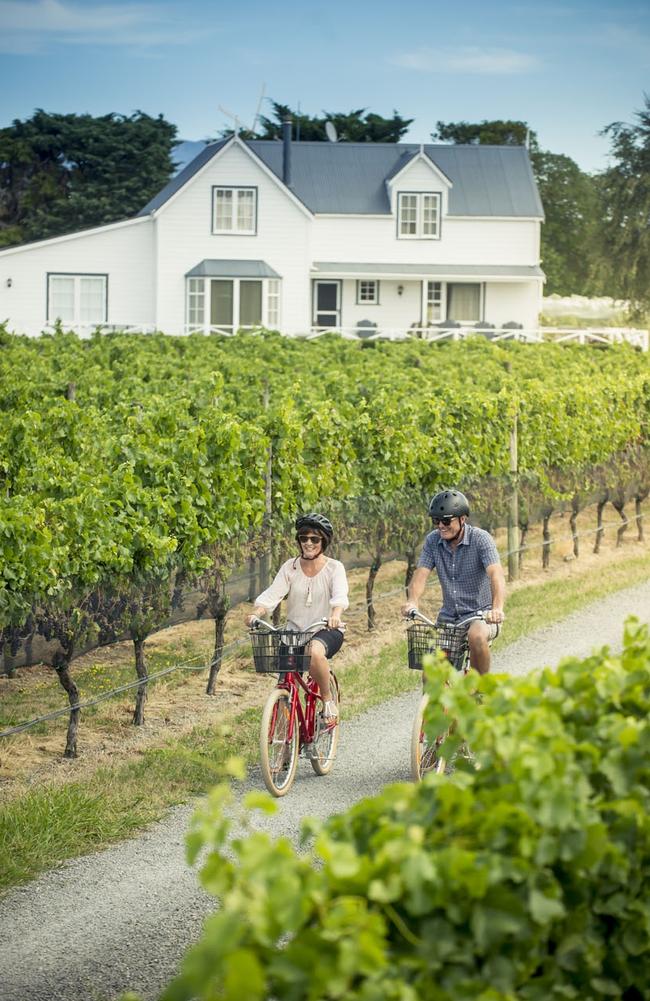 Cycling through the vines in Martinborough, New Zealand. Picture: Mike Heydon/JET Productions