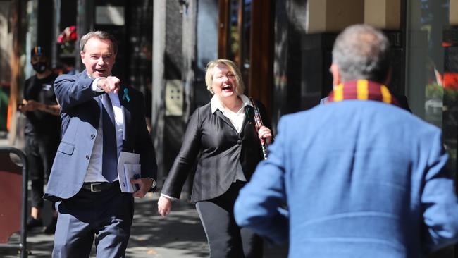 Liberal Party leader Michael O'Brien runs into Martin Pakula on the streets of Melbourne. Picture: Alex Coppel.