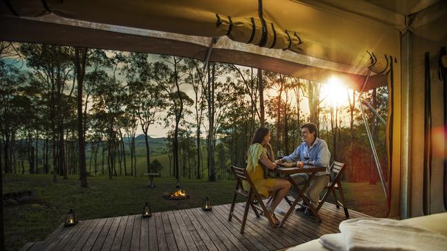 Dine on the deck to savour Scenic Rim views at Ketchup's Bank Glamping. Photo: Tourism and Events Queensland