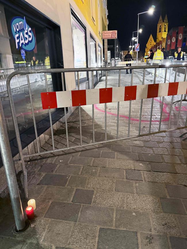 Memorial candles are lit the near the scene. Police are verifying eyewitness accounts that the attacker had shouted ‘Allahu Akbar’ (God is greatest. Picture: AFP