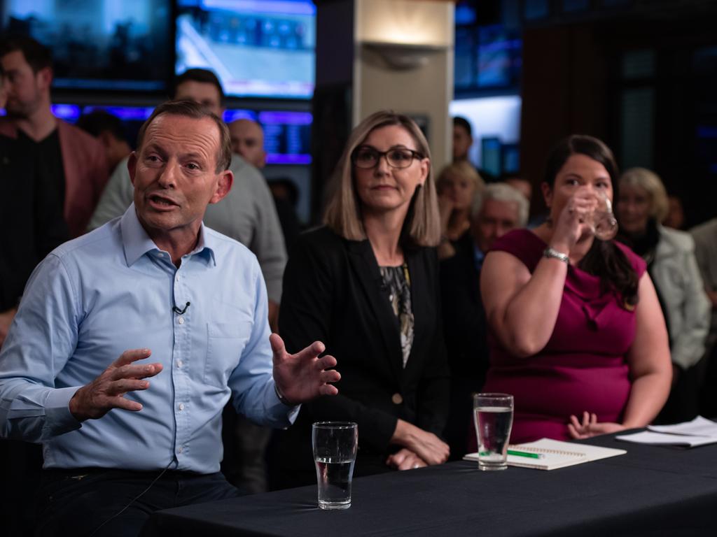 Former Prime Minister, Tony Abbott, United Australia Party candidate Suellen Wrightson (middle) and Greens candidate Kristyn Glanville speaking at the Harbord Beach Hotel.