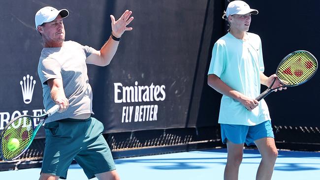 Lleyton and Cruz Hewitt hit the training court before this year’s Australian Open. Picture: Mark Stewart