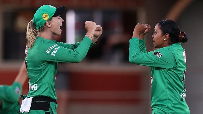 Alana King (right) celebrates one of her three wickets with teammate Meg Lanning. Picture: Ryan Pierse/Getty Images