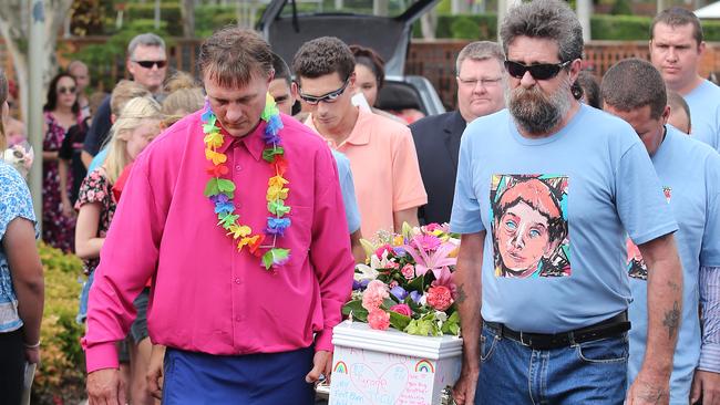 Blake Unsworth and family members carry the coffin of his Tyrone. Pictures: Jack Tran