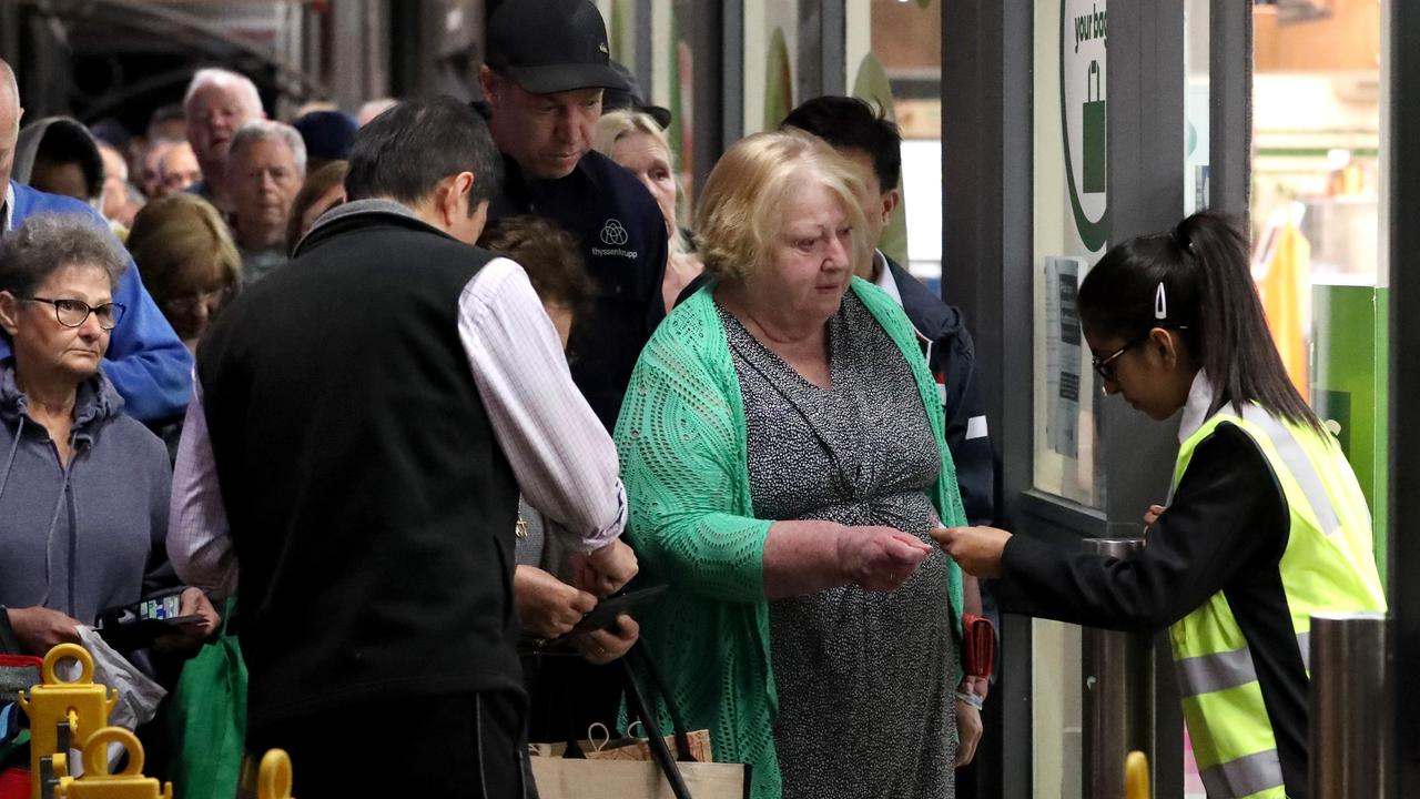 Security check concession and senior cards on the door at Woolies. Picture: David Geraghty