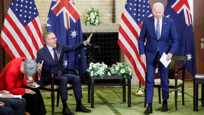 Joe Biden, right, jokingly stages a mock walkout at Kantei Palace in Tokyo on Tuesday as Anthony Albanese relates his experiences years ago on a US State Department program. Picture: Reuters