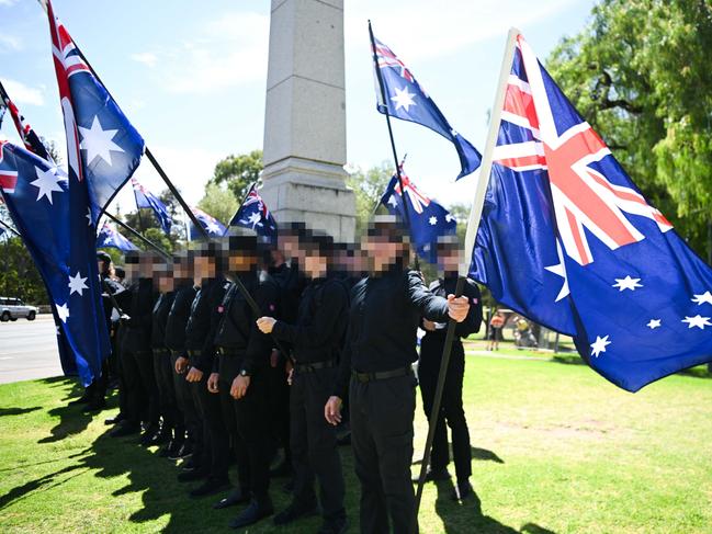 ADELAIDE, AUSTRALIA - JANUARY 26: Members of the National Socialist Network (NSN) during a counter protest on North Terrace and East Terrace on January 26, 2025 in Adelaide, Australia. Australia Day, formerly known as Foundation Day, is the official national day of Australia and is celebrated annually on January 26 to commemorate the arrival of the First Fleet to Sydney in 1788. Many indigenous Australians refer to the day as 'Invasion Day' and there is a small but growing movement to change the date amid broader debate on the day's significance. (Photo by Tracey Nearmy/Getty Images)