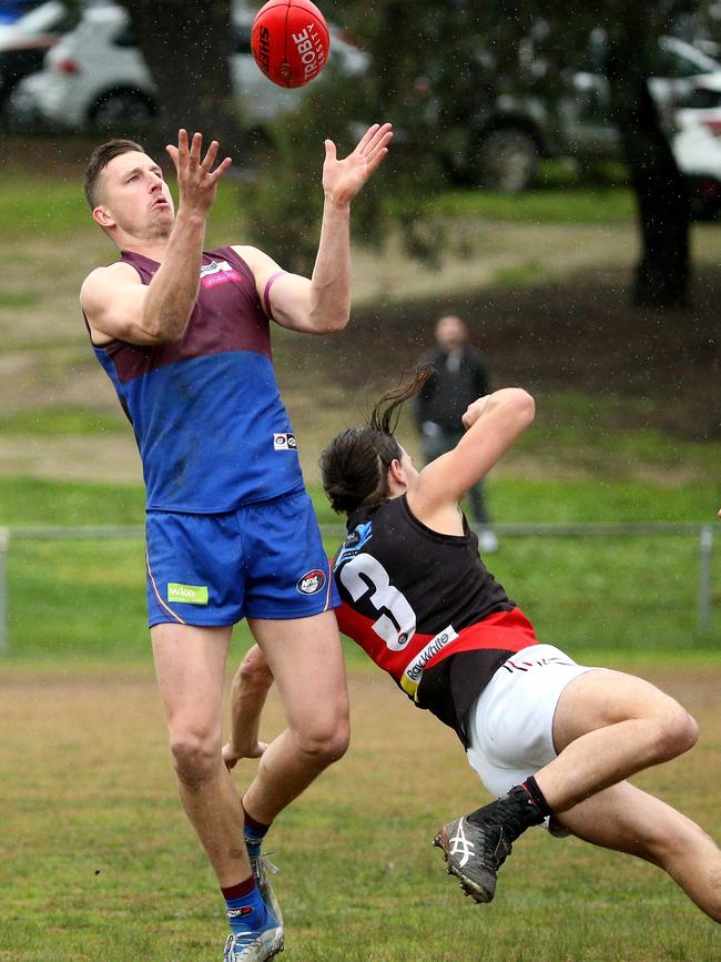 NFL: Banyule’s Jack Langford marks in front of Lane Sinclair of Eltham. Picture: Hamish Blair