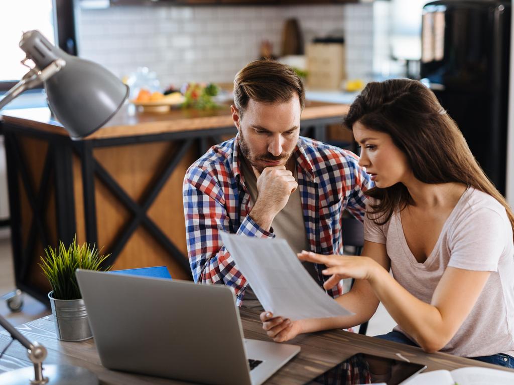 A couple discussing their bills including their mortgage. Picture: iStock.