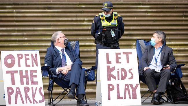 Liberal Democrat David Limbrick protesting the closure of parks outside Parliament House with Tim Quilty. Picture: Mark Stewart