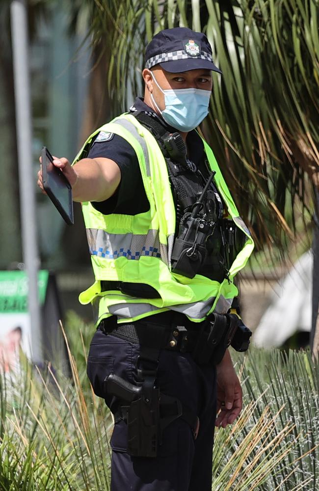 A police officer at the Queensland border in Griffith Street, Coolangatta. Picture: Nigel Hallett