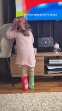 Toddler swaps shoes for pringles cans