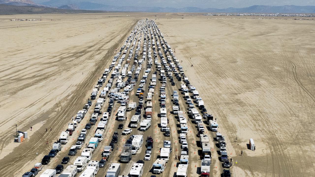 Vehicles are seen departing the Burning Man festival in Black Rock City. REUTERS/Matt Mills McKnight